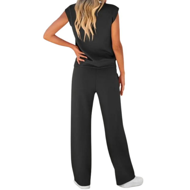 Back view of a woman wearing the Noelle black sleeveless lounge top and wide-leg pants co-ord set.