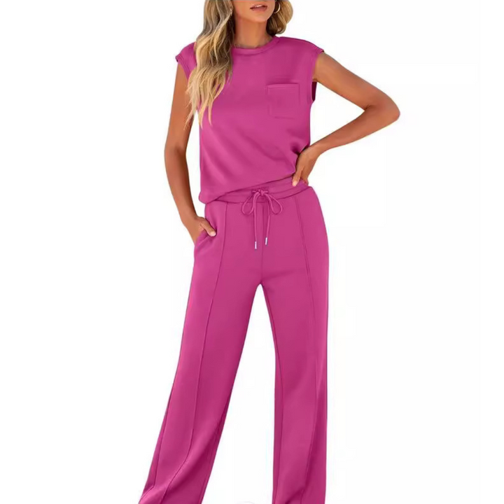 Woman wearing the Noelle magenta pink lounge co-ord set with a pocket tee and drawstring pants.