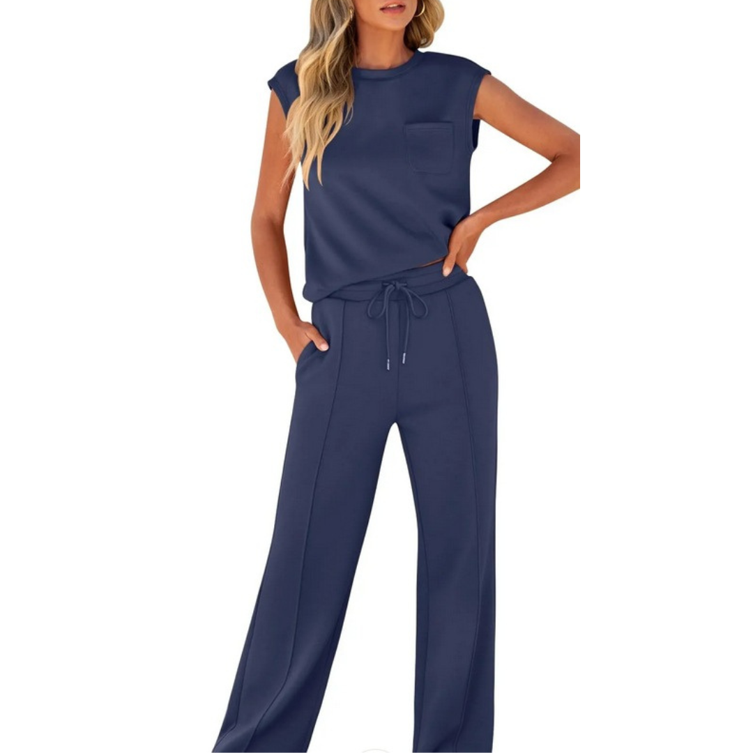Woman wearing the navy blue Noelle soft lounge co-ord set with sleeveless top and wide-leg pants.