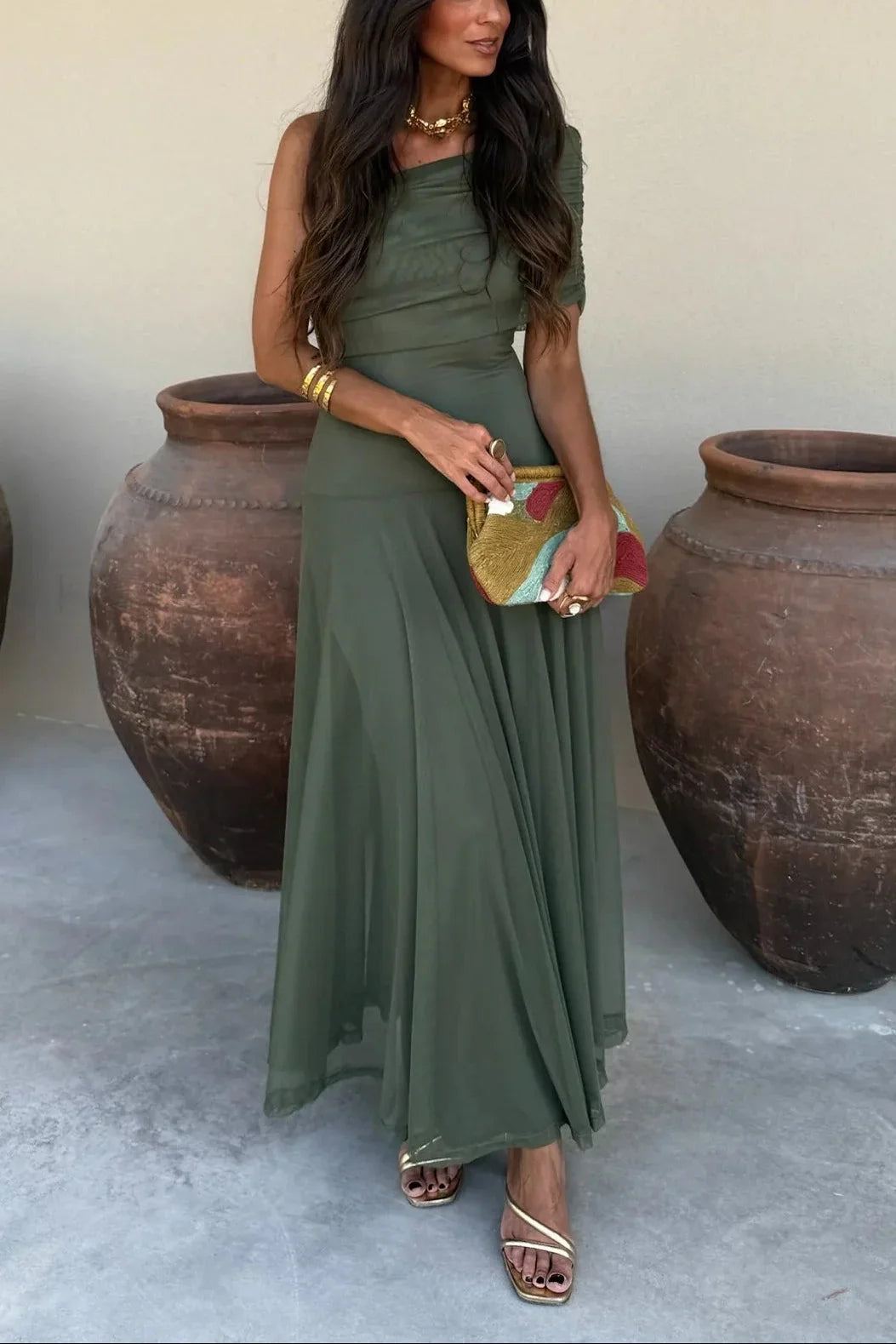 Nora Women's One Shoulder Pleated Maxi Dress in olive green, featuring a flowing silhouette and elegant accessories.