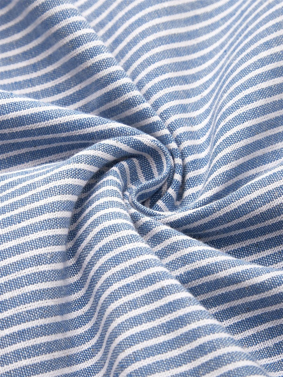 Close-up of the Nora dress fabric: classic blue and white striped, lightweight material.