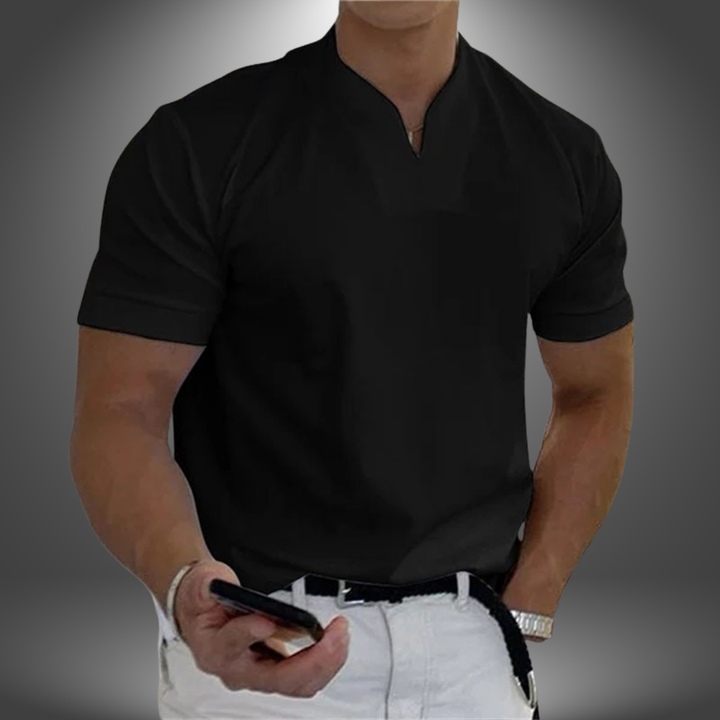 Owen men's black linen button-up collared shirt, featuring a relaxed cut and crisp finish, paired with white chinos.