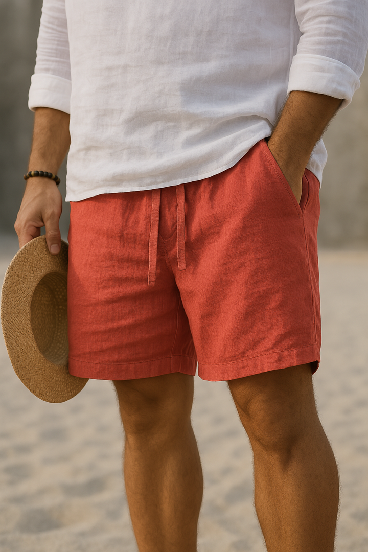 Men's Rafael above-knee drawstring shorts in a solid coral linen blend, with side pockets.
