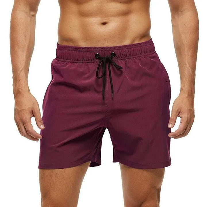 Men's maroon quick-dry swim shorts with an elastic drawstring waistband.