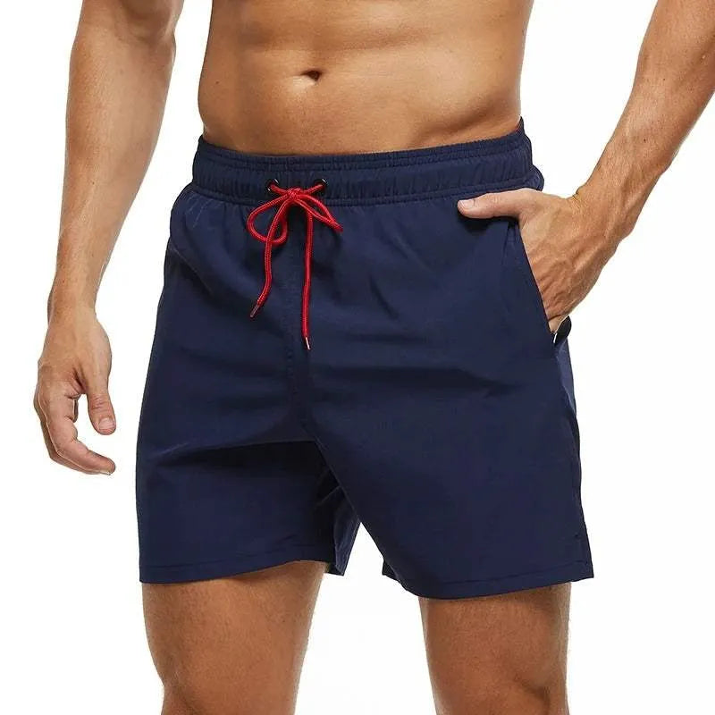 Men's navy blue quick-dry swim shorts with a red drawstring waistband.