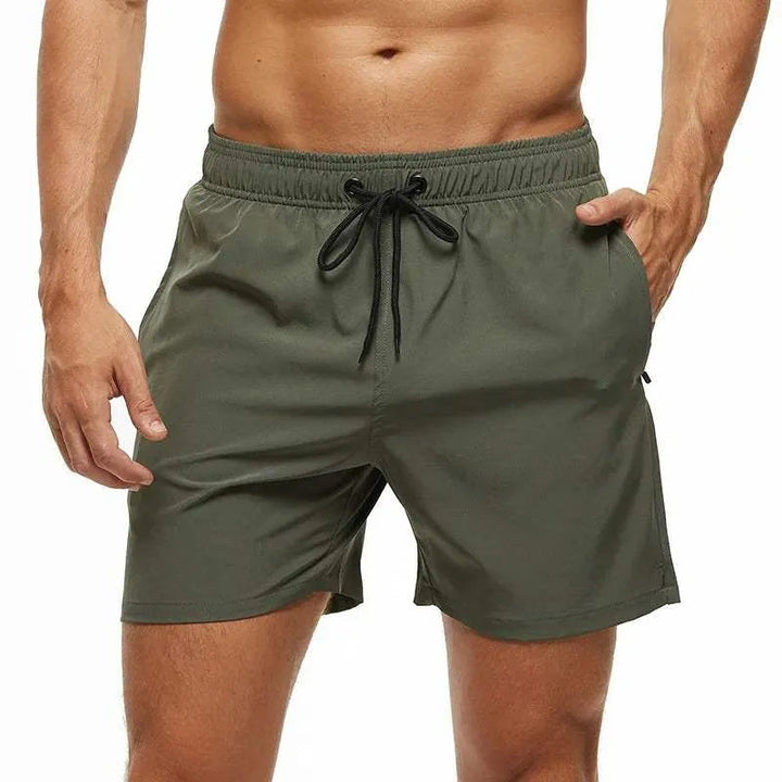 Men's olive green quick-dry swim shorts with an elastic drawstring waistband.