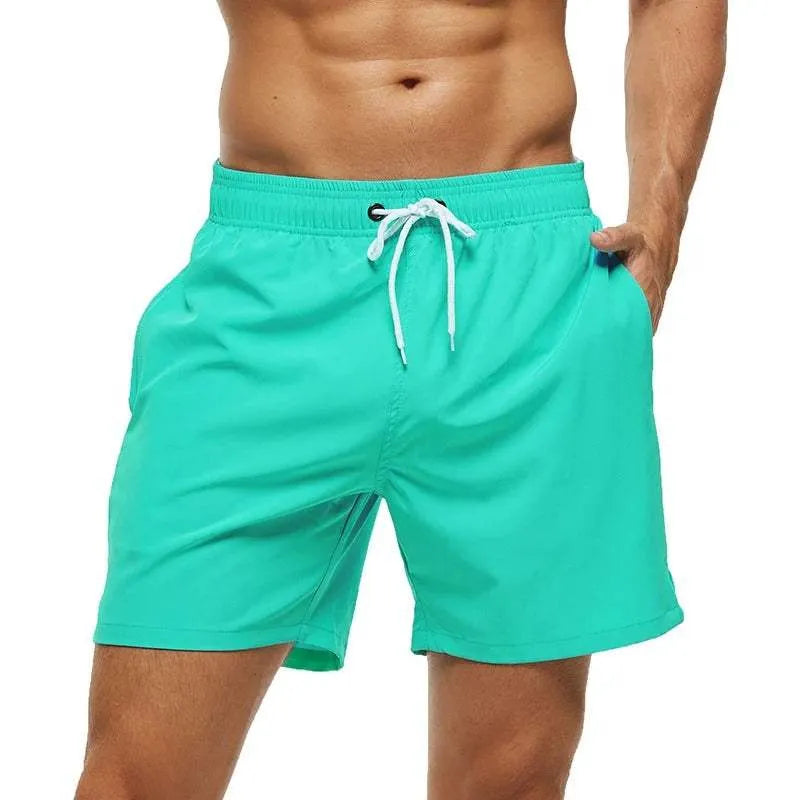 Men's mint green Reid quick-dry swim shorts with a white drawstring waistband.