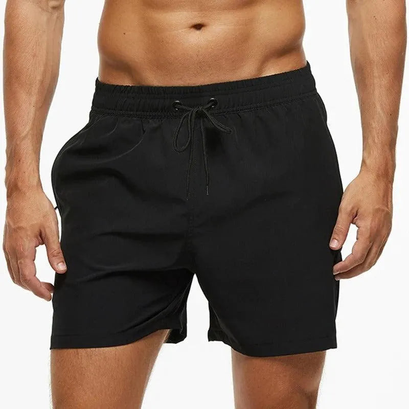 Men's black quick-dry swim shorts with an elastic drawstring waistband.