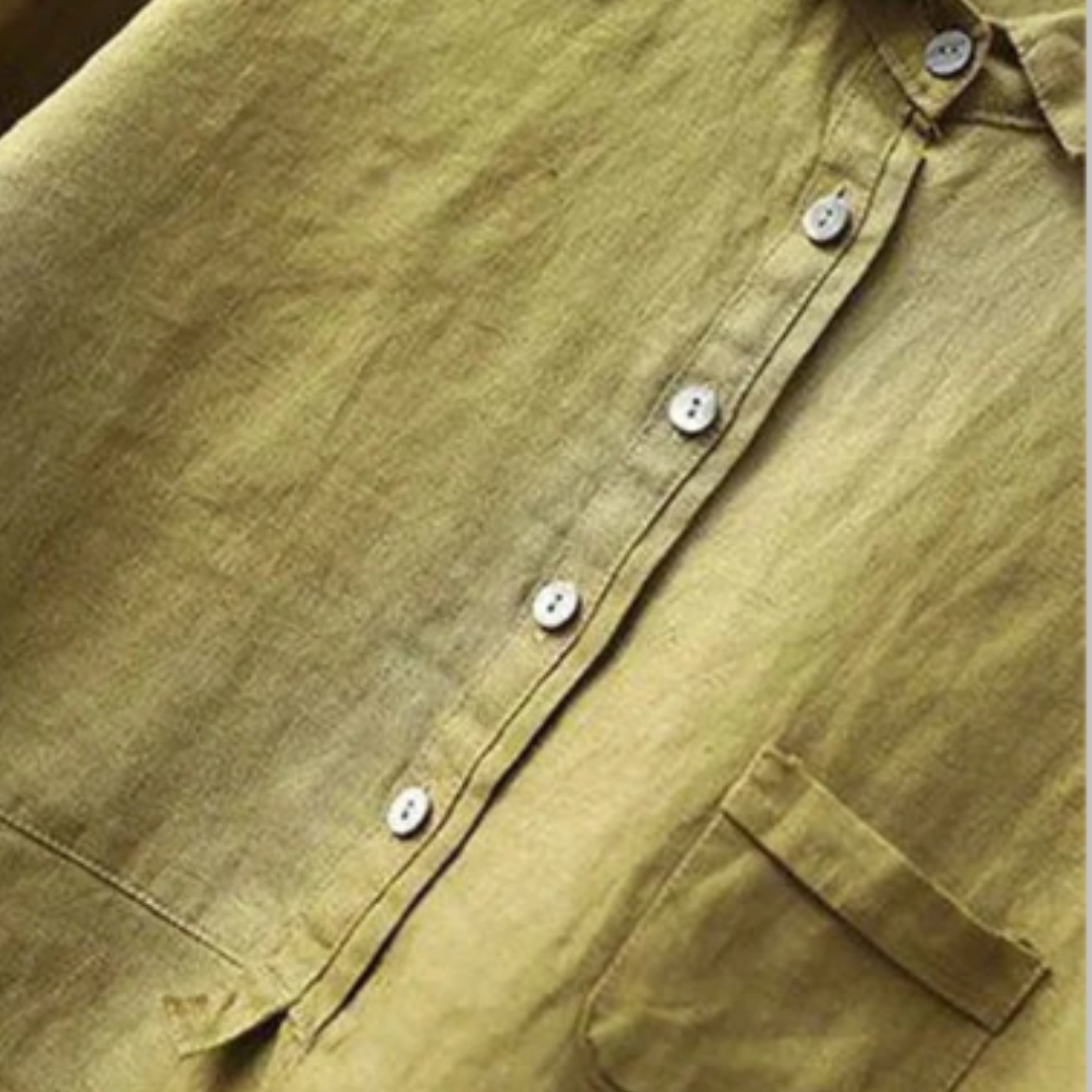 Close-up of the Rosalie olive green linen blouse featuring a half-placket button front and pocket.