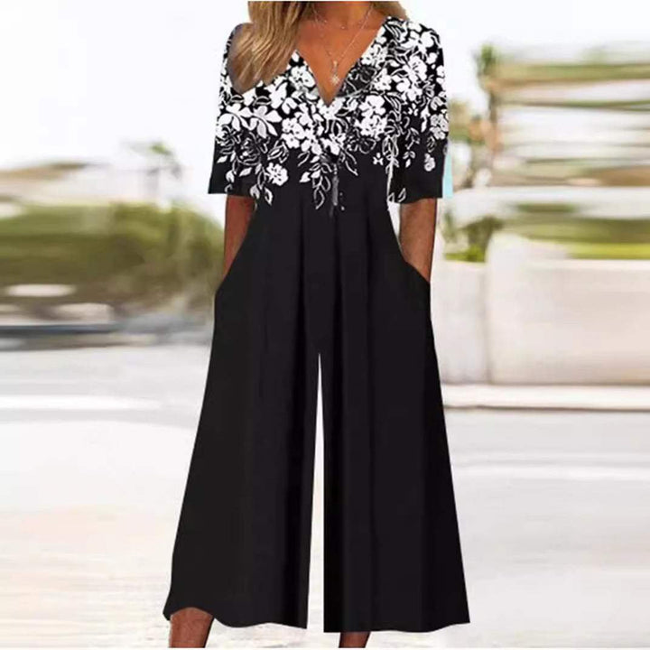 Women's black V-neck wide-leg boho floral jumpsuit with half sleeves and pockets.