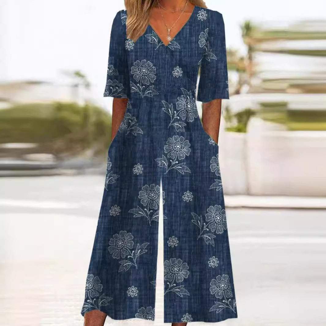 Scarlett women's blue boho floral V-neck wide-leg jumpsuit with half sleeves and pockets.