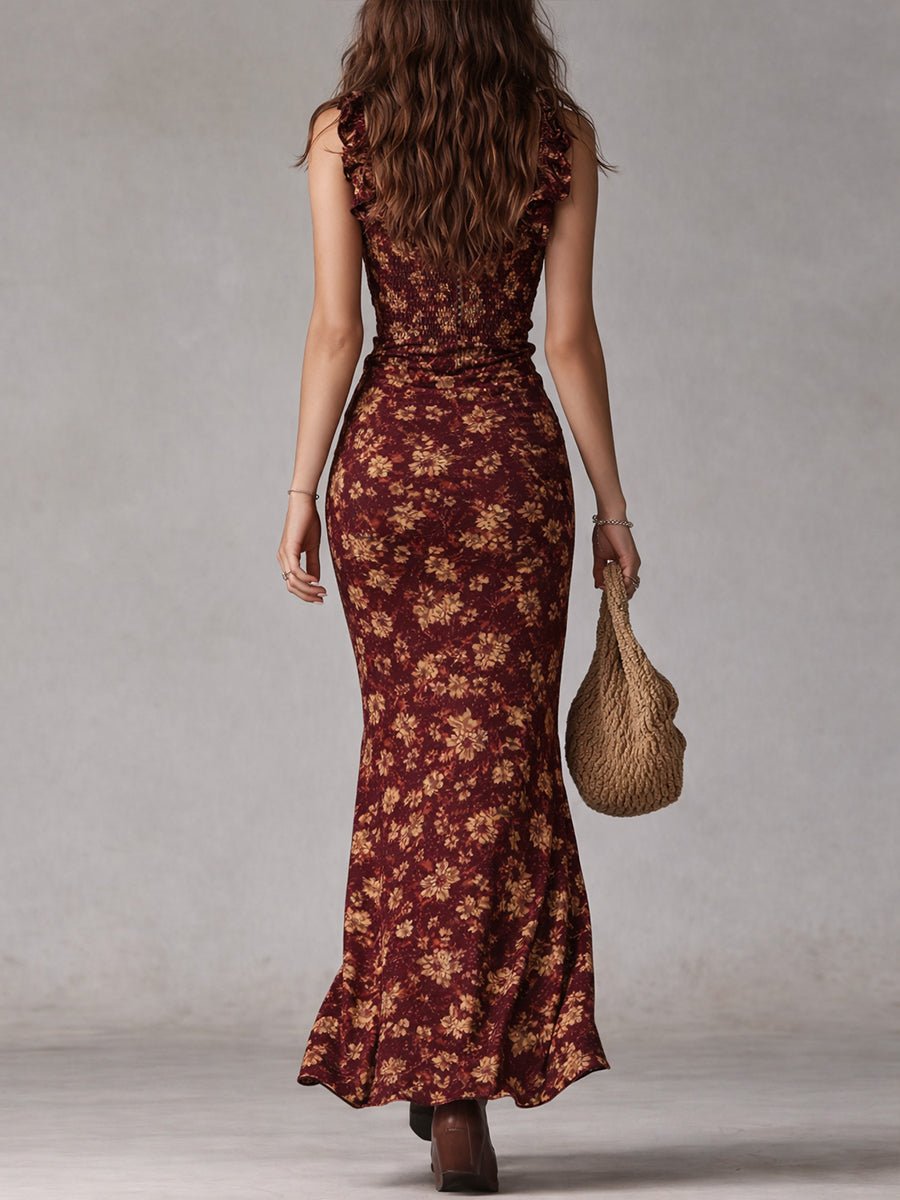 Women's Soraya smocked ruffle maxi boho floral dress in burgundy with gold flowers, seen from behind.