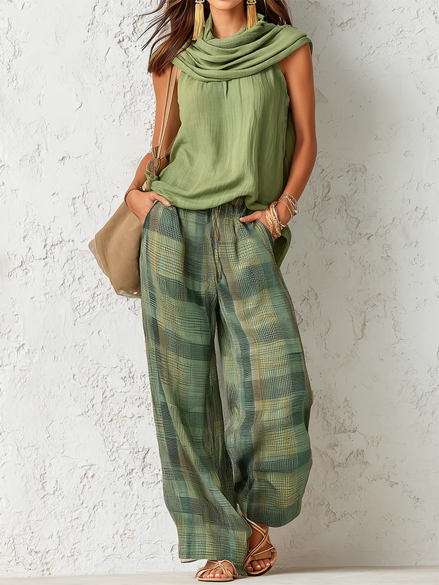 Stella green sleeveless blouse and plaid wide-leg pants set with a matching scarf.