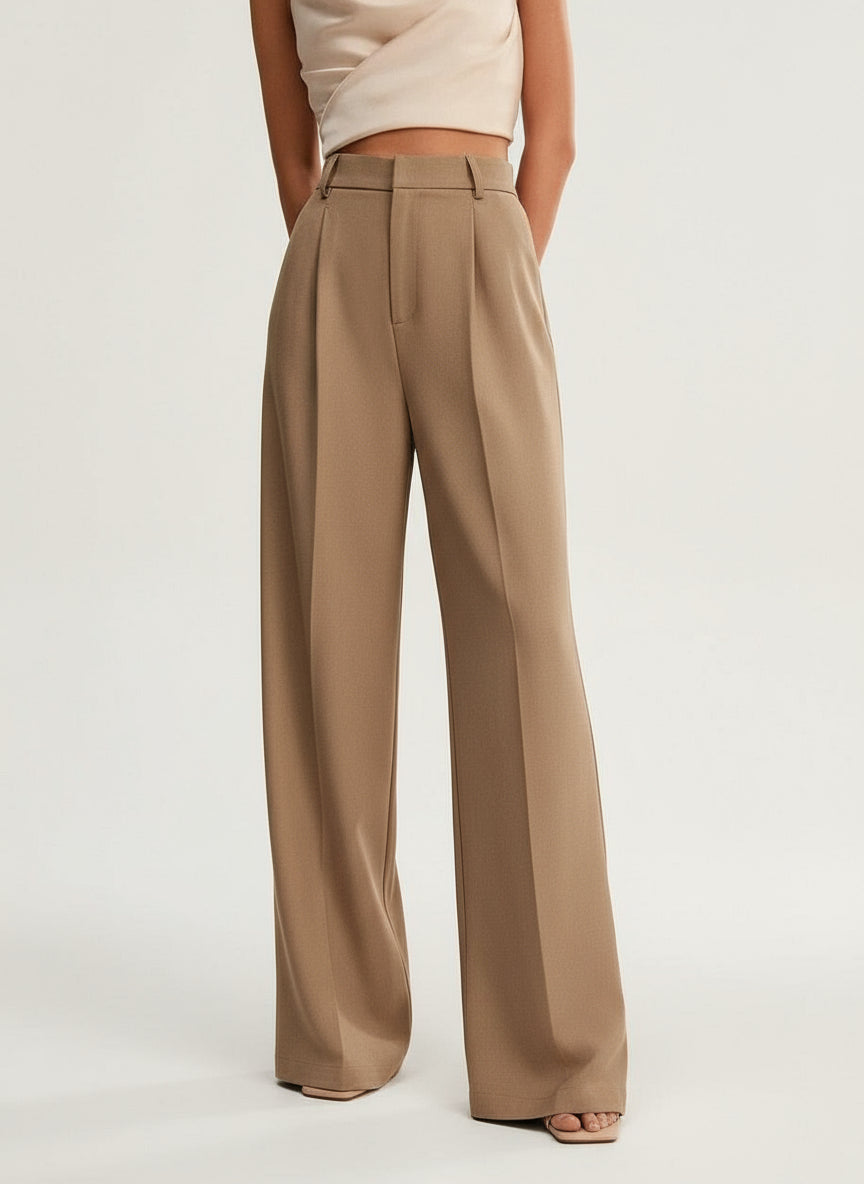 Stella women's high-waist wide-leg pants in a refined tan, featuring tailored construction and a flowing silhouette.
