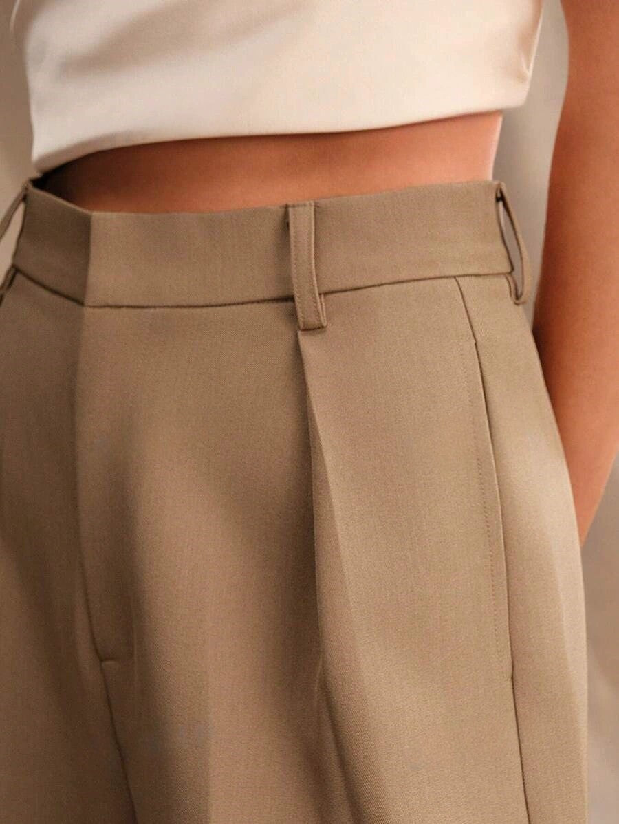 Stella women's high-waist wide-leg pants in a refined tan, showcasing tailored lines and a sleek, confident fit.