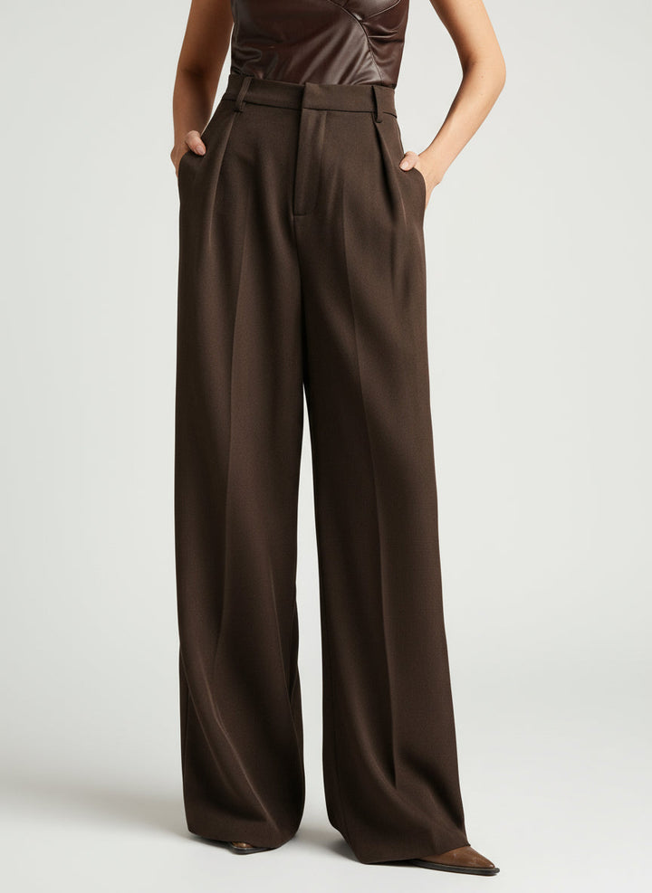 Stella women's high-waist wide-leg pants in dark brown, featuring tailored construction and a flowing silhouette.