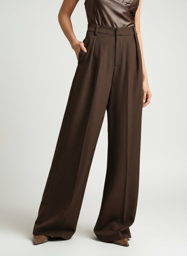 Stella women's high-waist, wide-leg brown tailored pants with a flowing cut and sleek lines.