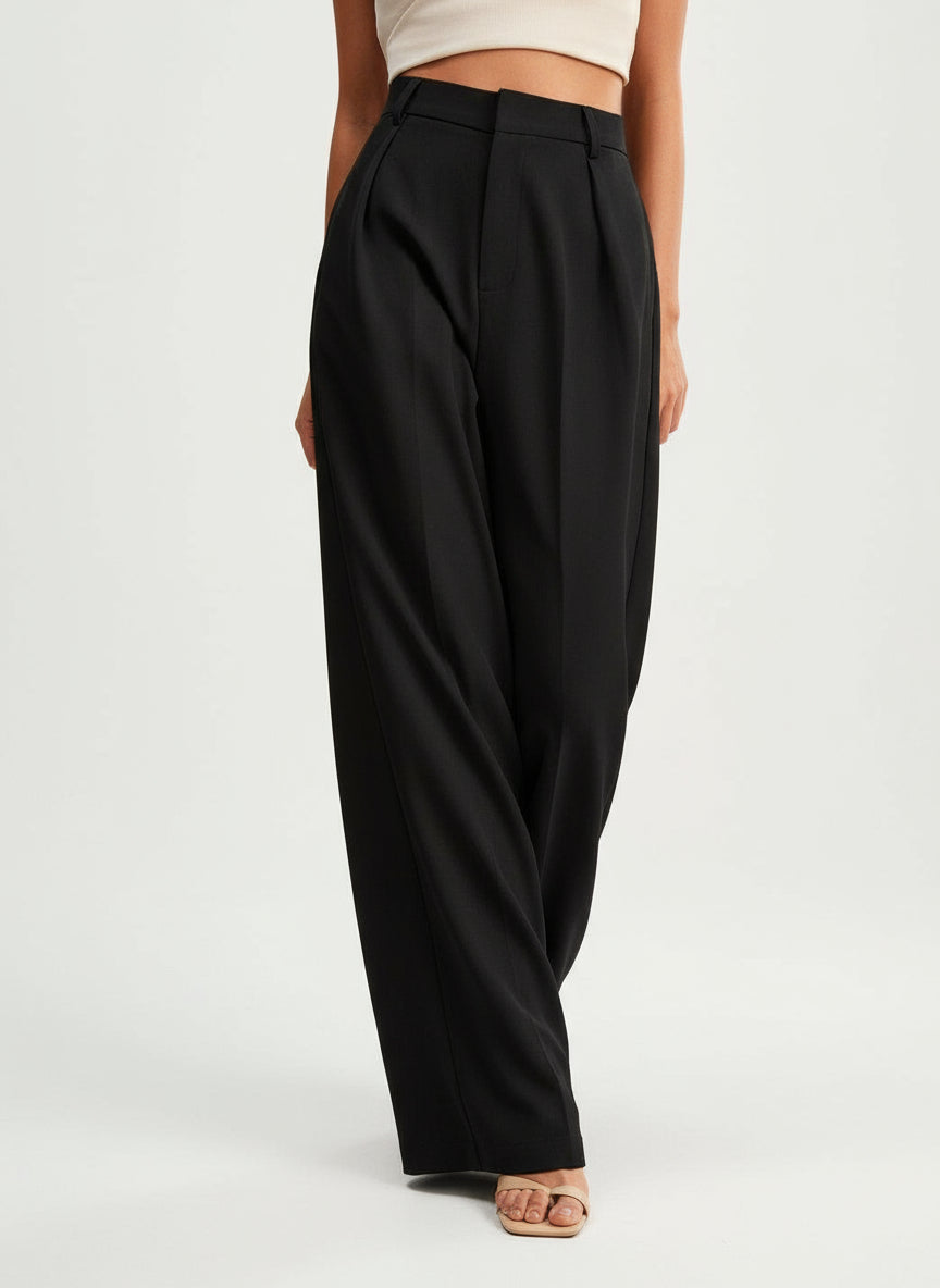 Stella women's black high-waist wide-leg pants with tailored pleats and a flowing silhouette.