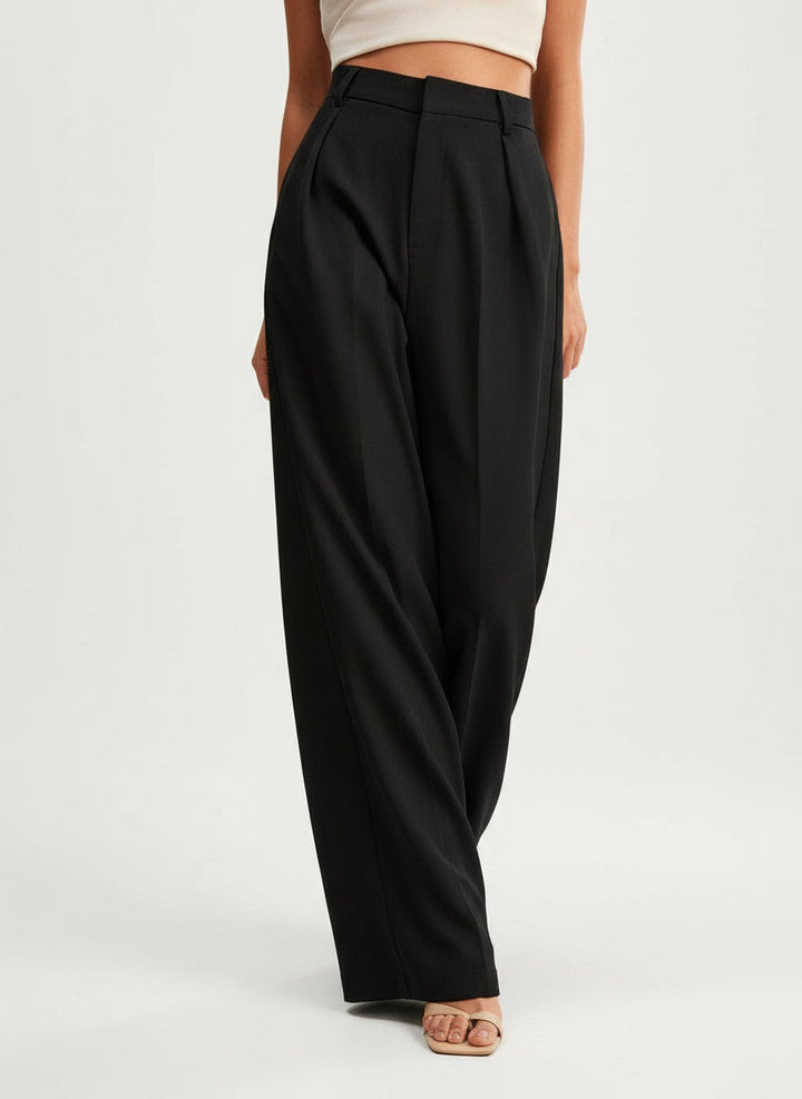 Stella women's black high-waist wide-leg pants with tailored pleats and a flowing silhouette.
