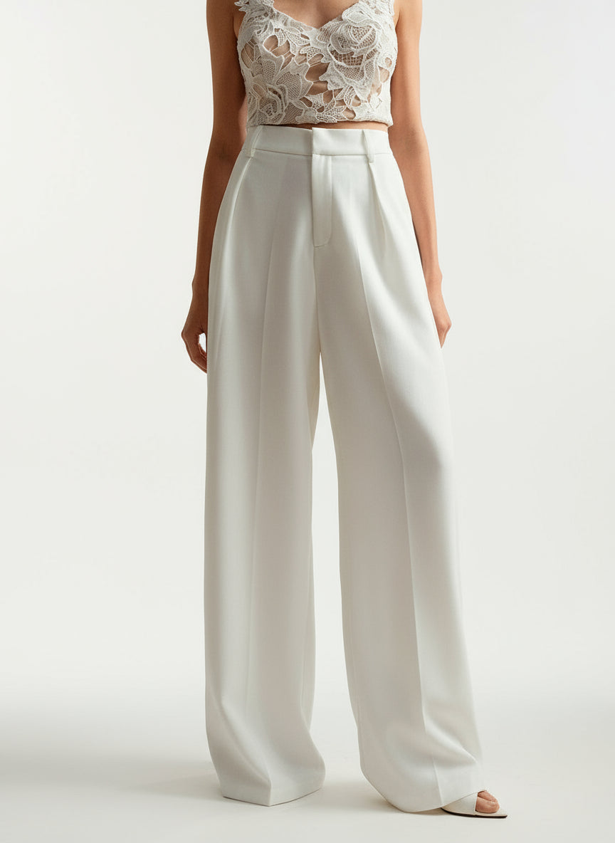 Stella women's high-waist wide-leg pants in crisp white, featuring tailored lines and a flowing silhouette.