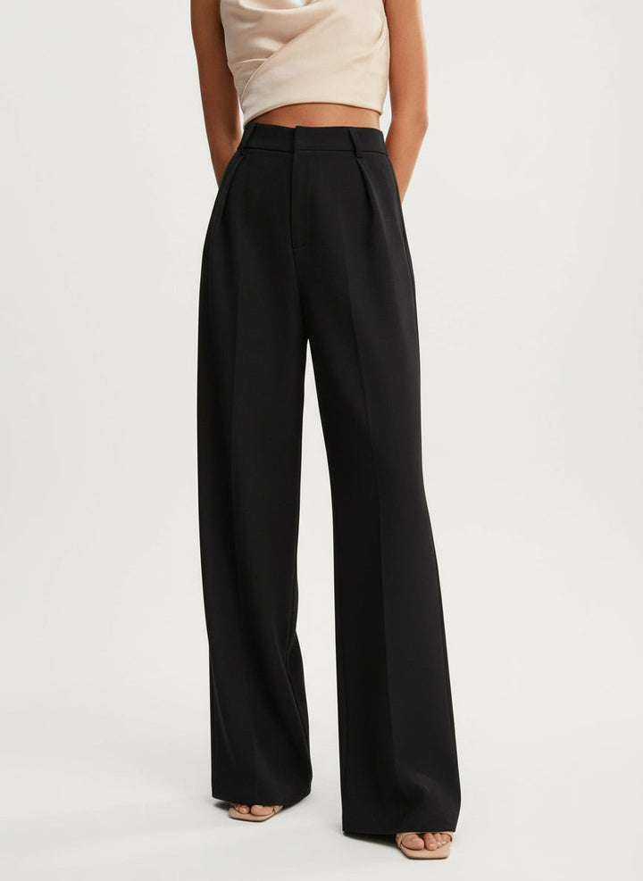 Stella women's black high-waist wide-leg pants with tailored pleats and a flowing silhouette.