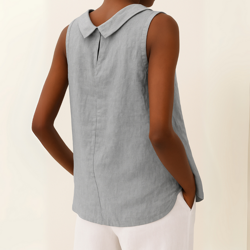 Back view of a light grey sleeveless top with a modern roll collar and a soft, draped linen-blend fabric.