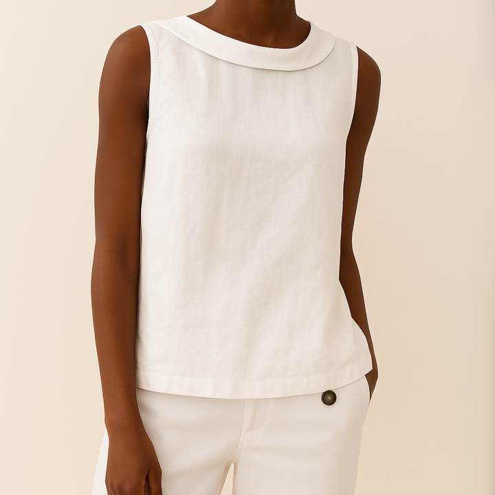 White sleeveless top featuring a modern roll collar and a soft, draped silhouette for a polished, feminine fit.