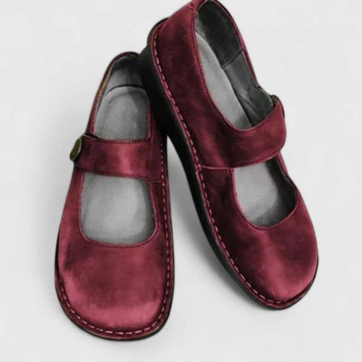 Talia burgundy suede orthopedic Mary Jane shoes with adjustable straps and rounded toes.