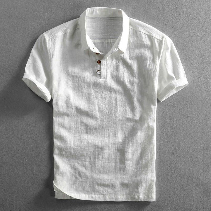 Men's white Troy short-sleeve polo shirt with classic collar, button placket, and textured fabric.