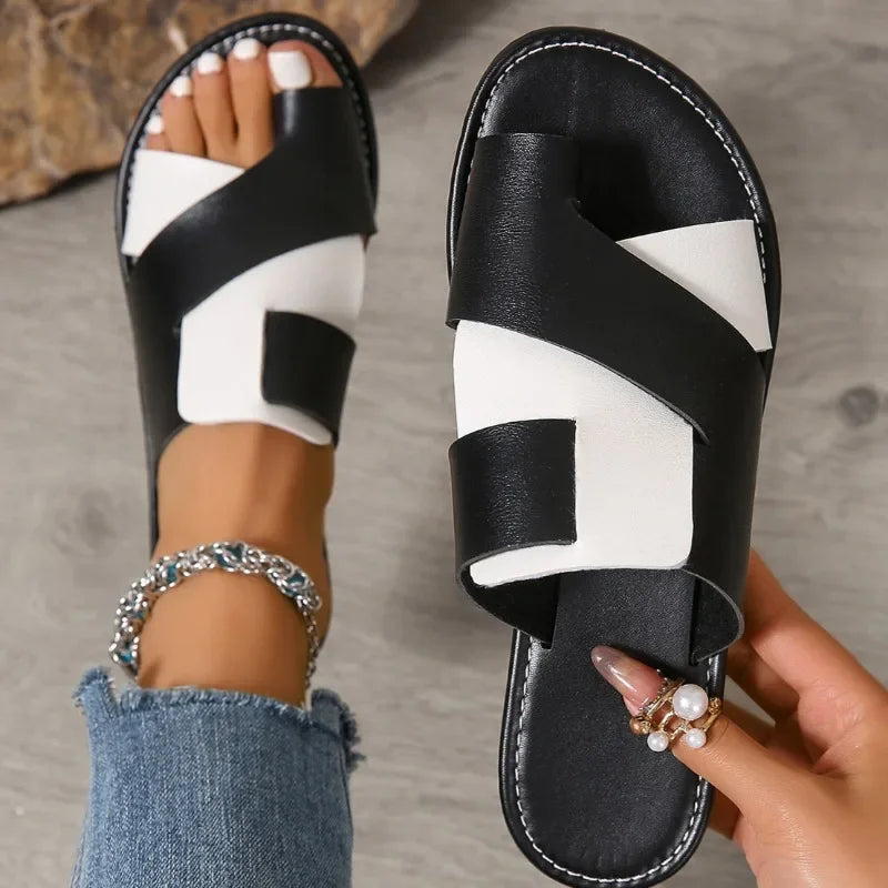 Women's Veda two-tone leather slide sandals with a toe loop, featuring brown and beige straps.