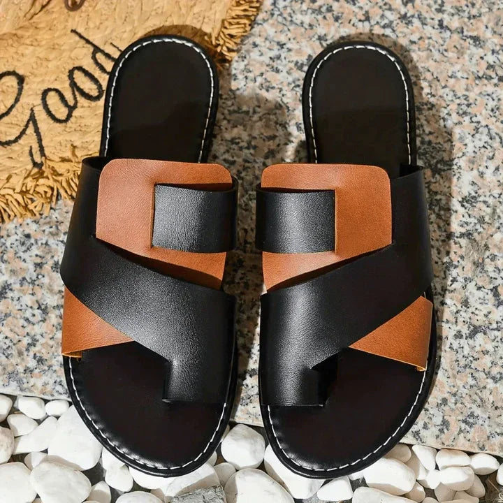 Women's Veda two-tone leather slide sandals with a toe loop, featuring brown and beige straps.