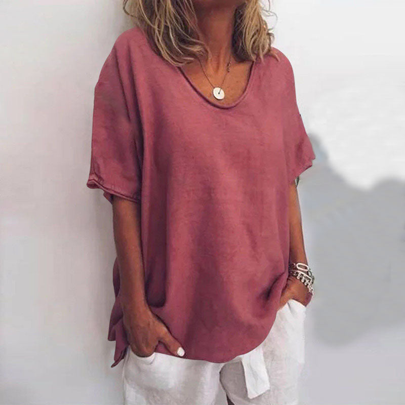 Dusty rose V-neck blouse in a soft, flowing fabric with short sleeves and a relaxed, comfortable fit.