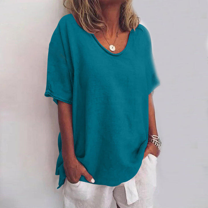 Teal blue V-neck flowy blouse with short sleeves and a relaxed, draped fit for a polished look.