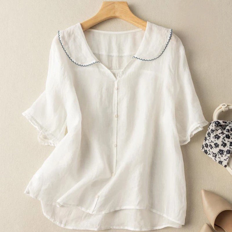 White Zinnia women's button-front blouse with a scalloped collar and short sleeves.