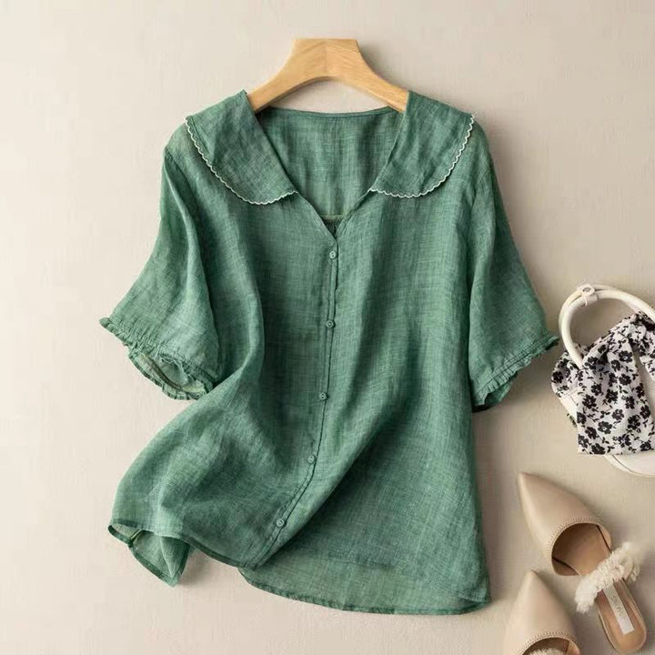 Green Zinnia women's button-front blouse with a scalloped collar and short sleeves.