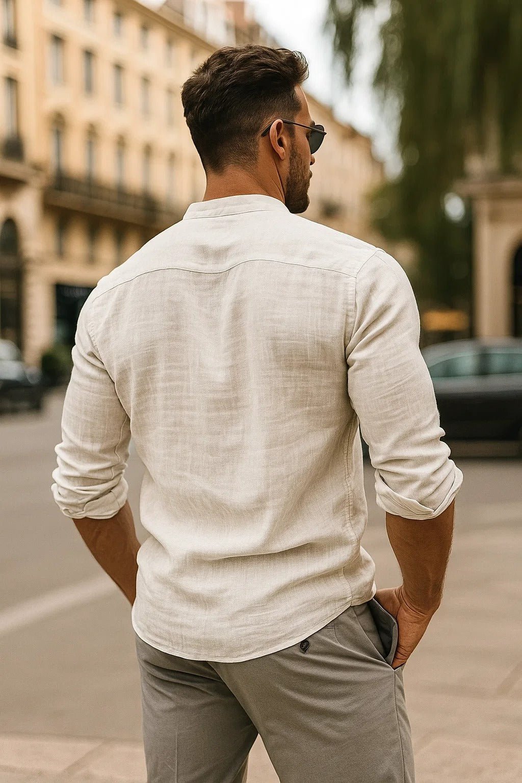 Men's Zion band collar button-up shirt in light beige, textured fabric, with sleeves rolled.