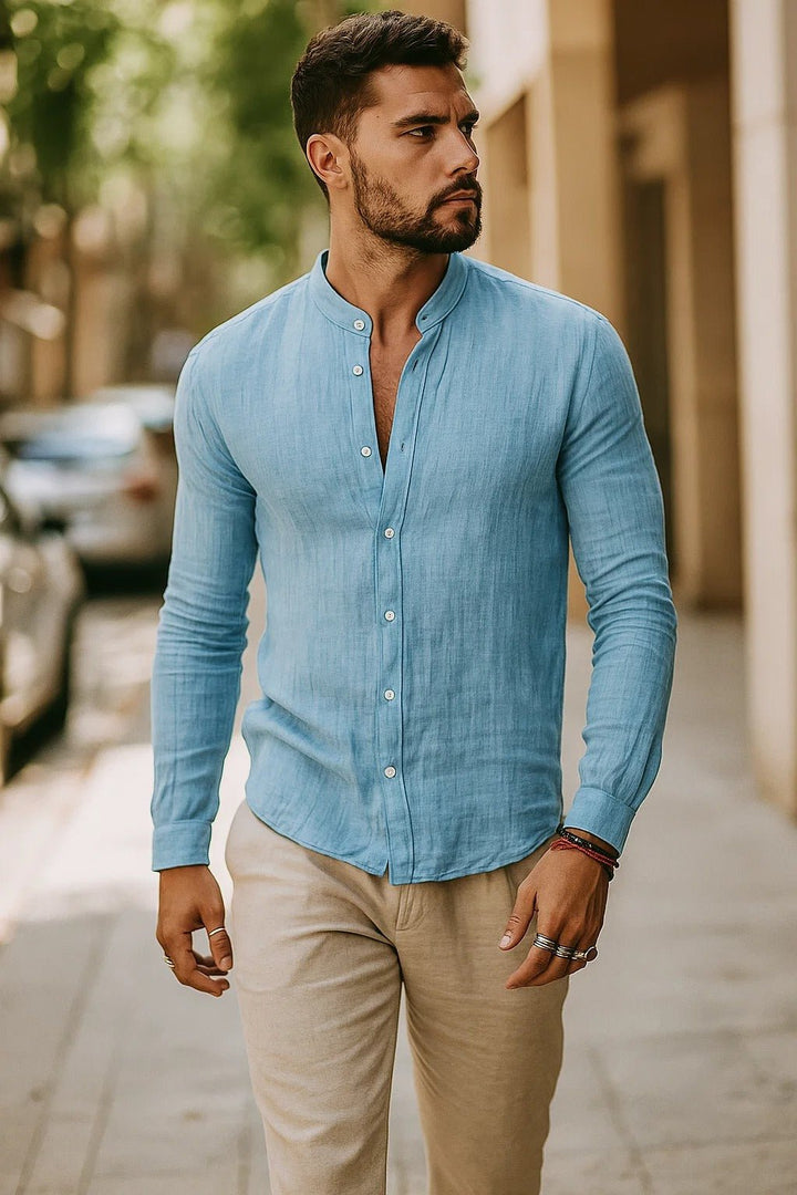 Men's Zion light blue band collar button-up shirt with long sleeves and textured fabric.
