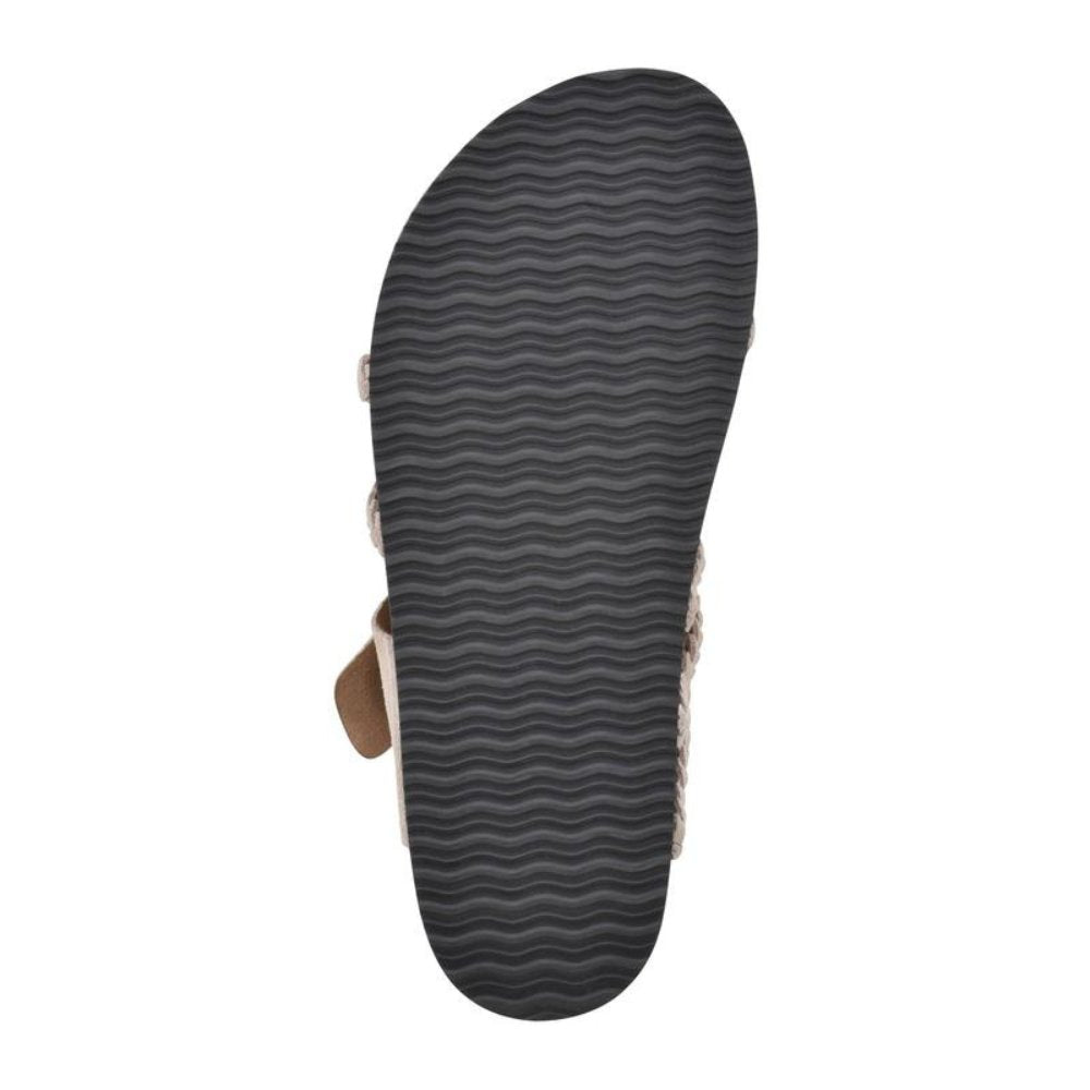 Zoe women's sandal, showing the black textured non-slip outsole and a hint of the cork-style footbed.