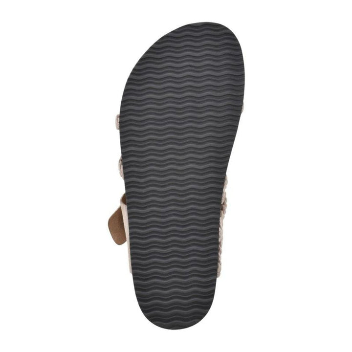 Zoe women's sandal, showing the black textured non-slip outsole and a hint of the cork-style footbed.
